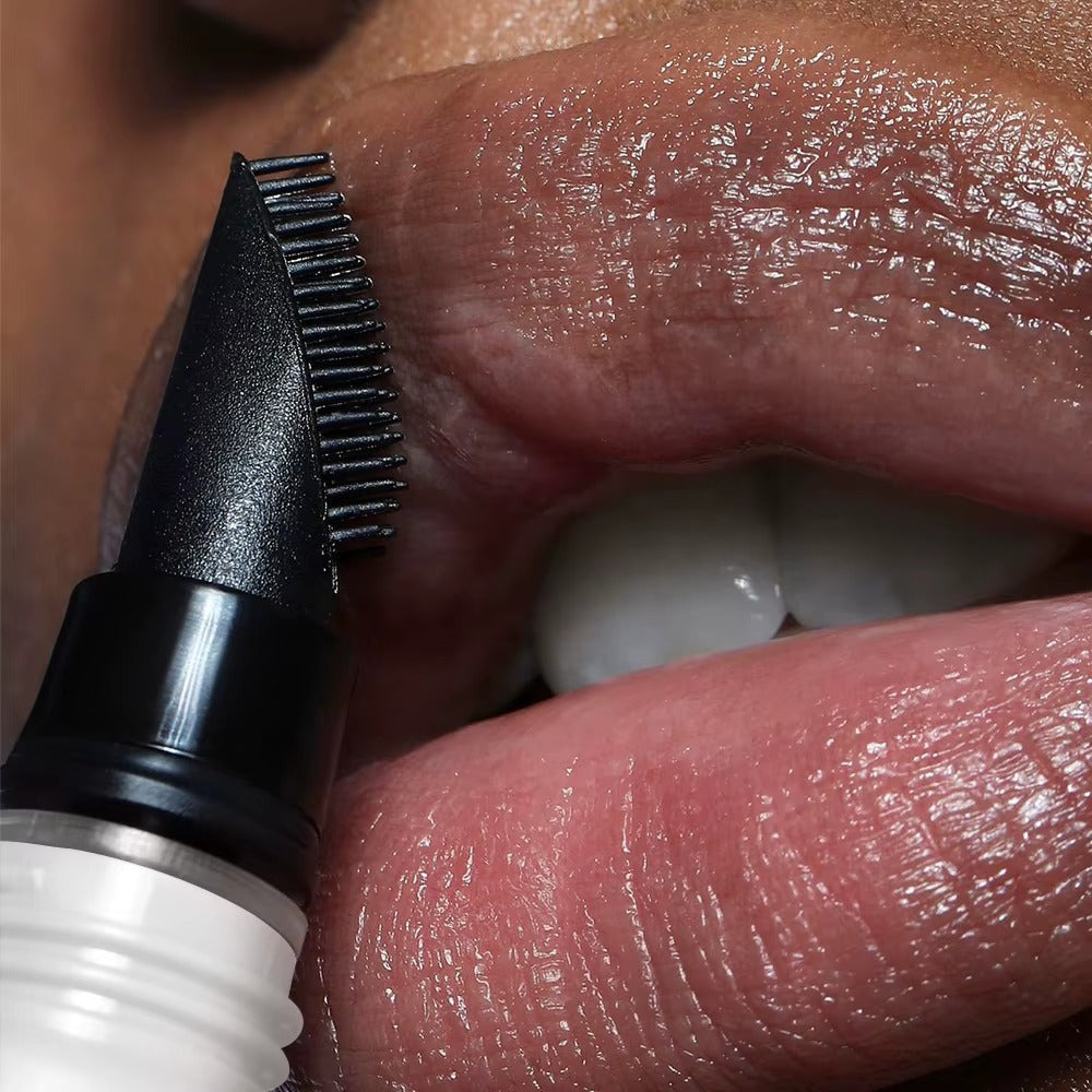 Applying LOPURE Lip Buff Balm with the buffing tip